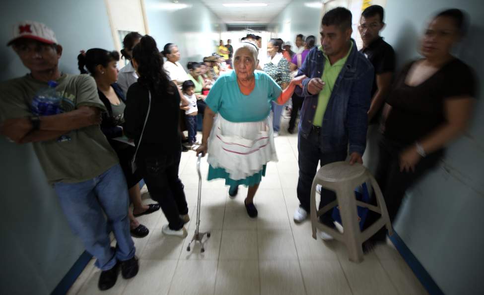 Lucia Moyorga arrives with her son's support for her pre-operation assessment by the Operation Walk team.