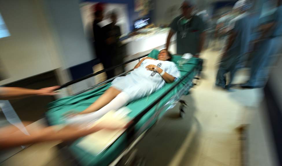 Sylvia Vega is wheeled into the OR.