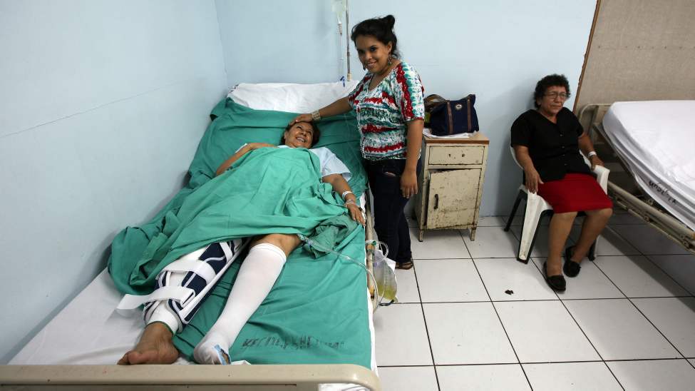 Sylvia Vega's daughter mirrors her mother's smile after coming to the ward following her operation.