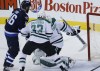 John Woods / WINNIPEG FREE PRESS
Winnipeg Jets' Andrew Ladd (16) and Dallas Stars' Alex Goligoski (33)  watch as Jets' Bryan Little's (18) first-period shot gets past Stars goaltender Jhonas Enroth. It was the lone goal of the period.