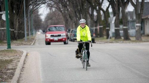 Melissa Tait / Winnipeg Free Pre
Bev Peters bikes down Powers Street in the north end of Winnipeg on her way to the North Star Diner.  Mary Agnes story on traffic and cyclists 140506 - Tuesday, May 06, 2014 - (Melissa Tait / Winnipeg Free Press)