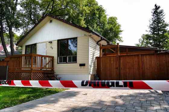 BORIS MINKEVICH / WINNIPEG FREE PRESSThe fire started around 5 a.m. Tuesday at a home in the first 100 block of Fifth Avenue. Emergency responders picked up a seriously injured man nearby and rushed him to hospital, where he remains.