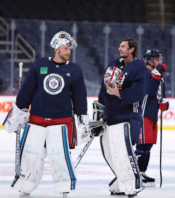 Winnipeg Jets coach Paul Maurice elected to start Laurent Brossoit (left) over Connor Hellebuyck (right) against the Islanders on Sunday. (Ruth Bonneville / Winnipeg Free Press files)