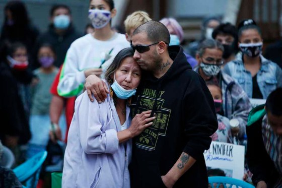 JOHN WOODS / WINNIPEG FREE PRESSCandy Volk, the mother of Jennifer Dethmers, is comforted at a vigil in September 2020. (John Woods / Winnipeg Free Press files)