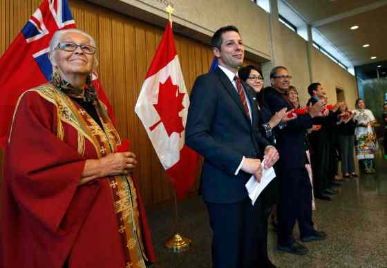 Wayne Glowacki / Winnipeg Free Press Mayor Brian Bowman (centre) with Elder Mae Louise Campbell (left ).