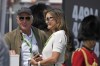 LIV Golf CEO Greg Norman stands on a tee box with his wife Kirsten Kutner during the final round of the inaugural LIV Golf Invitational at the Centurion Club in St. Albans, England, Saturday, June 11, 2022. (AP Photo/Alastair Grant)