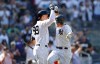 New York Yankees' DJ LeMahieu, right, celebrates with teammate Aaron Judge (99) after hitting a home run against the Houston Astros during the eighth inning of a baseball game, Sunday, June 26, 2022, in New York. (AP Photo/Noah K. Murray)