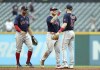 Boston Red Sox players from left, Xander Bogaerts, Alex Verdugo and Trevor Story celebrate after defeating the Cleveland Guardians 8-3 in a baseball game in Cleveland, Sunday, June 26, 2022. (Joshua Gunter/Cleveland.com via AP)
