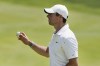 Rory McIlroy holds up his ball after finishing his round on the 18th hole during the final round of the Travelers Championship golf tournament at TPC River Highlands, Sunday, June 26, 2022, in Cromwell, Conn. (AP Photo/Seth Wenig)