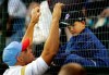 FILE - Former major leaguer Dante Bichette, left, talks with his son Bo Bichette, 7, in the stands before coaching his older son Dante Bichette Jr.'s little league team representing Maitland, Fla., against Davenport, Iowa at the Little League World Series in South Williamsport, Pa., Friday, Aug. 19, 2005. In all, more than two dozen major league offspring are on AL or NL rosters this year. The Blue Jays alone have three, including the sons of Hall of Famers Craig Biggio (Cavan) and Vladimir Guerrero (Vlad Jr.), along with Bo Bichette, whose father, Dante, was a four-time All-Star with the Rockies. (AP Photo/Gene J. Puskar, File)