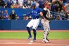 Toronto Blue Jays' centre fielder George Springer crosses the plate after an RBI double by teammate Bo Bichette, not shown, in first inning American League baseball action against the Boston Red Sox, in Toronto on Monday June 27, 2022. THE CANADIAN PRESS/Jon Blacker