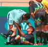 FILE - Miami Fusion's Tyrone Marshall (15) assists Kansas City Wizards' Scott Vermillion after the two collided while going up for a header in the first half of a soccer match Sunday, Aug. 29, 1999, in Kansas City, Mo. Researchers have diagnosed chronic traumatic encephalopathy in a Major League Soccer player for the first time, saying Tuesday, June 28, 2022, that former Sporting Kansas City defender Scott Vermillion suffered from the degenerative brain disease. (AP Photo/Ed Zurga, File)