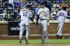 Houston Astros' Yuli Gurriel (10) celebrates with Astros' Kyle Tucker (30) after Gurriel hits a home run against New York Mets relief pitcher Chasen Shreve during the fifth inning of a baseball game, Tuesday, June 28, 2022, in New York. (AP Photo/Jessie Alcheh)
