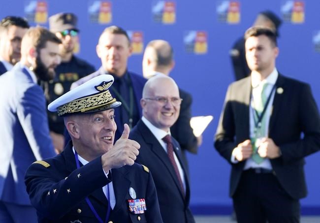Supreme Allied Commander Transformation General Philippe Lavigne, left, gestures as he arrives for the NATO summit in Madrid, Spain on Wednesday, June 29, 2022. North Atlantic Treaty Organization heads of state will meet for a NATO summit in Madrid from Tuesday through Thursday. (AP Photo/Paul White)