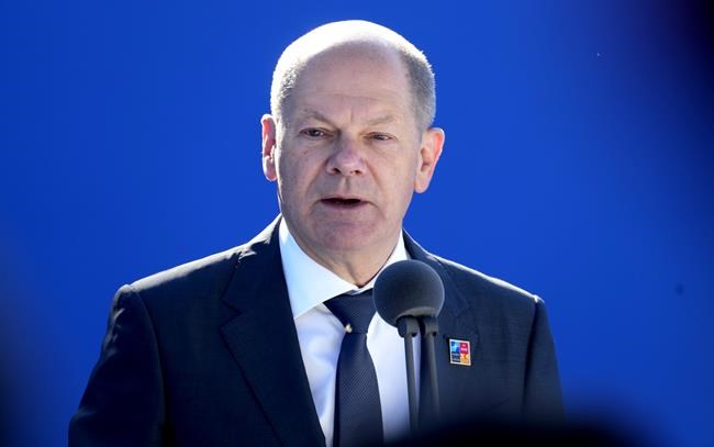 German Chancellor Olaf Scholz speaks with the media as he arrives for the NATO summit in Madrid, Spain on Wednesday, June 29, 2022. North Atlantic Treaty Organization heads of state will meet for a NATO summit in Madrid from Tuesday through Thursday. (AP Photo/Paul White)