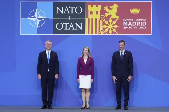 NATO Secretary General Jens Stoltenberg, Estonia's Prime Minister Kaja Kallas and Spanish Prime Minister Pedro Sanchez, from left, pose for the media at the official welcome for the NATO summit in Madrid, Spain, on Wednesday, June 29, 2022. North Atlantic Treaty Organization heads of state will meet for a NATO summit in Madrid from Tuesday through Thursday. (AP Photo/Bernat Armangue)