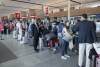 Passengers lineup at the check in counter at Pierre Elliott Trudeau airport, in Montreal, Wednesday, June 29, 2022. An analytics firm says a majority of domestic flights to some of Canada's busiest airports were delayed or cancelled over the past week. THE CANADIAN PRESS/Ryan Remiorz