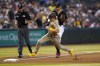 San Diego Padres' Jake Cronenworth rounds the bases to score on a base hit by Luke Voit during the seventh inning of a baseball game against the Arizona Diamondbacks, Wednesday, June 29, 2022, in Phoenix. (AP Photo/Matt York)