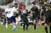 Vancouver Whitecaps forward&nbsp;Cristian Dájome, center left, and Los Angeles FC midfielder&nbsp;Ilie Sánchez&nbsp;(6) kick the ball during the first half of an MLS soccer match in Los Angeles, Sunday, March 20, 2022.&nbsp; THE CANADIAN PRESS/AP-Ashley Landis