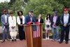 Brett Eagleson, who was 15 when his father Bruce was killed in the terrorist attack in New York, is among the speakers at a news conference Thursday, June 30, 2022 at the North Plains Veterans Park in North Plains, Ore. Thursday, June 30, 2022. The Saudi Arabia-backed LIV Golf tour teed off Thursday, angering a group of families who lost loved ones on Sept. 11 and want the Saudi government held to account for the terrorist attacks. (Beth Nakamura/The Oregonian via AP)