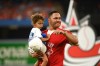 Former Toronto Blue Jays catcher Russell Martin with one of his daughters watches a video display of his time with the team after announcing his retirement from professional baseball before the game between the Blue Jays and the Tampa Bay Rays in Toronto on Friday, July 1, 2022. THE CANADIAN PRESS/Jon Blacker