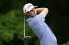 J.T. Poston hits off the second tee during the second round of the John Deere Classic golf tournament, Friday, July 1, 2022, at TPC Deere Run in Silvis, Ill. (AP Photo/Charlie Neibergall)