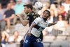 Vancouver Whitecaps' Javain Brown, front right, and Los Angeles FC's Ryan Hollingshead vie for the ball during the first half of an MLS soccer game in Vancouver, on Saturday, July 2, 2022. THE CANADIAN PRESS/Darryl Dyck
