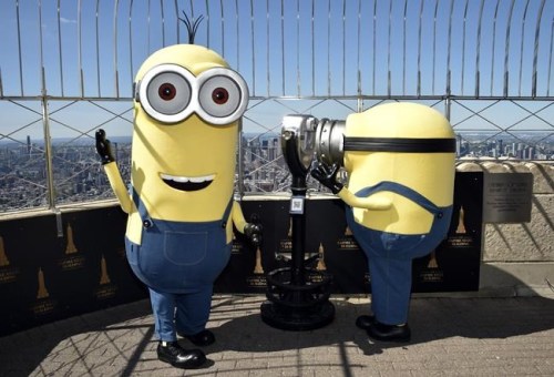 Minion characters Kevin, left, and Bob pose on the 86th floor observatory deck at the Empire State Building to celebrate the upcoming film 