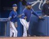 Toronto Blue Jays' Vladimir Guerrero Jr., right, pretends to coach with first base coach Mark Budzinski in the sixth inning of their American League MLB baseball game against the Tampa Bay Rays in Toronto Saturday September 28, 2019. THE CANADIAN PRESS/Fred Thornhill