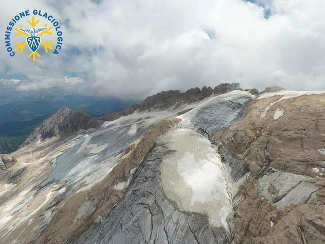 This undated image released on Monday, July 4, 2022, by the Glaciological Commission of the Tridentine Alpinists Society shows the Fedaia glacier in Italy's Alps near Trento before a large chunk broke loose on Sunday, killing at least six hikers and injuring eight others. Drones were being used to spot any more bodies because conditions downslope from the glacier, which has been melting for decades, were still too unstable to immediately send rescuers and dogs into the area to look for others buried under tons of debris. (Cristian Ferrari/ Commissione Glaciologica Società Alpinisti Tridentini via AP)