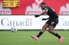 Canada's Cyle Larin, 17, scores against the USA during men's first half World Cup Qualifier at sold out Tim Hortons Field in Hamilton, Ontario on Sunday Jan. 30, 2022. Larin is joining fellow Canadian Tajon Buchanan at Belgium's Club Brugge. THE CANADIAN PRESS/Nathan Denette