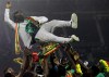FILE - Senegal's players celebrate with Senegal's head coach Aliou Cisse after winning the African Cup of Nations 2022 final soccer match between Senegal and Egypt at the Ahmadou Ahidjo stadium in Yaounde, Cameroon, on Feb. 6, 2022. The next African Cup of Nations will again clash with the European season and likely give rise to more club vs. country friction and disgruntlement over the release of players after organizers decided to postpone it until January 2024. The decision was announced Sunday, July 3, 2022, by the Confederation of African Football. (AP Photo/Sunday Alamba)