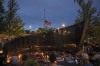 Dozens of mourners gather for a vigil near Central Avenue and St. Johns Avenue in downtown Highland Park, one day after a gunman killed at least seven people and wounded dozens more by firing an AR-15-style rifle from a rooftop onto a crowd attending Highland Park's Fourth of July parade, Tuesday, July 5, 2022 in Highland Park, Ill.. THE CANADIAN PRESS/Chicago Sun-Times-Anthony Vazquez&nbsp;via AP)