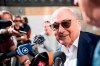 The former president of the World Football Association (Fifa), Joseph Blatter, surrounded by media representatives, gives statements in front of the Swiss Federal Criminal Court in Bellinzona, Switzerland, before the last day of the trail, when the verdict is to be announced, Friday, July 8, 2022. Blatter and the former president of the the European Football Association (Uefa), Michel Platini, stand trial before the Federal Criminal Court from Wednesday, over a suspicious two-million payment. The Federal Prosecutor's Office accuses them of fraud. The defense speaks of a conspiracy. (Ti-Press/Alessandro Crinari/Keystone via AP)