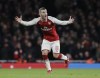 FILE - Arsenal's Jack Wilshere shouts during the English League Cup semifinal second leg soccer match between Chelsea and Arsenal at the Emirates stadium in London, Wednesday, Jan. 24, 2018. Former Arsenal and England midfielder Jack Wilshere retired from playing at the age of 30 on Friday, July 8, 2022 after an injury-disrupted career. (AP Photo/Matt Dunham, File)