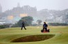 FILE - Workers are shown tending to the 17th green on the Old Course, St Andrews, Scotland, Saturday, July, 10, 2010. The Open Championship returns to the home of golf on July 14-17 to celebrate the 150th edition of the sport's oldest championship, which dates to 1860 and was first played at St. Andrews in 1873. (AP Photo/Peter Morrison, File)