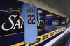 A jersey honoring 8-year-old Cooper Roberts, who was paralyzed from the waist down during a July 4 mass shooting in Highland Park, is seen in the Milwaukee Brewers dugout before a baseball game against the Pittsburgh Pirates Friday, July 8, 2022, in Milwaukee. (AP Photo/Morry Gash)