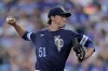 Kansas City Royals starting pitcher Brady Singer throws during the first inning of a baseball game against the Cleveland Guardians Friday, July 8, 2022, in Kansas City, Mo. (AP Photo/Charlie Riedel)