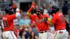Atlanta Braves' Ronald Acuna Jr., center, celebrates with Michael Harris II, left, and Orlando Arcia (11) after hitting a three-run home run off Washington Nationals' Erick Fedde during the second inning of a baseball game Friday, July 8, 2022, in Atlanta. (AP Photo/Ben Margot)