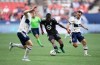 Minnesota United's DJ Taylor, centre, moves the ball past Vancouver Whitecaps' Russell Teibert, right, during the first half of an MLS soccer game in Vancouver, B.C., Friday, July 8, 2022. THE CANADIAN PRESS/Darryl Dyck