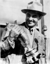 FILE - Sam Snead holds the British Open trophy he won, July 5, 1946, at St. Andrews, Scotland, with a 72-hole score of 290. He was the first American to win the trophy since 1933. (AP Photo, File)