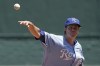 Kansas City Royals starting pitcher Zack Greinke throws during the first inning of a baseball game against the Cleveland Guardians Sunday, July 10, 2022, in Kansas City, Mo. (AP Photo/Charlie Riedel)