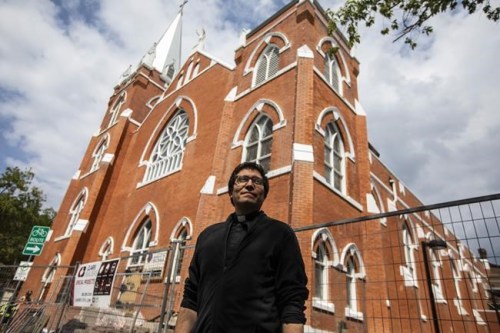 Father Cristino Bouvette outside Scared Heart Church in Edmonton, Thursday, June 30, 2022.&nbsp;Cultures collide each Sunday morning at Edmonton's Sacred Heart Church of the First Peoples, with sage burning alongside candles and both hymns and Indigenous drumming resounding through congregations. THE CANADIAN PRESS/Jason Franson