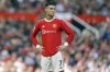 FILE- Manchester United's Cristiano Ronaldo stands on the pitch during the English Premier League soccer match between Manchester United and Norwich City at Old Trafford stadium in Manchester, England, on April 16, 2022. Amid doubts over Ronaldo's future at the club, Manchester United manager Erik ten Hag has said that Cristiano Ronaldo is “not for sale.