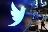 FILE - The logo for Twitter appears above a trading post on the floor of the New York Stock Exchange, Nov. 29, 2021. Twitter's stock slid more than 6% before the market open Monday, July 11, 2022, after billionaire Elon Musk announced late Friday that he will abandon his $44 billion offer to buy Twitter and the company said it will sue the Tesla CEO to uphold the deal. (AP Photo/Richard Drew, File)
