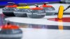 A broom and curling stones are shown at the Brier in Lethbridge, Alta., Sunday, March 6, 2022. The Continental Cup curling tournament has been cancelled for a third straight season as Curling Canada continues to revamp its competition schedule for the 2022-23 campaign.THE CANADIAN PRESS/Jeff McIntosh