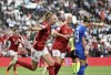 Denmark players celebrate after Denmark's Pernille Harder scoring her side's first goal during the Women Euro 2022 group B soccer match between Denmark and Finland at MK stadium in Milton Keynes, England, Tuesday, July 12, 2022. (AP Photo/Rui Vieira)