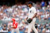 New York Yankees starting pitcher Luis Severino, right, waits as Cincinnati Reds' Mike Moustakas runs the bases on a home run during the second inning of a baseball game Wednesday, July 13, 2022, in New York. (AP Photo/Frank Franklin II)