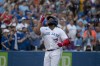Toronto Blue Jays first baseman Vladimir Guerrero Jr. (27) celebrates after his home run during fourth inning interleague MLB action against the Philadelphia Phillies in Toronto on Wednesday, July 13, 2022. THE CANADIAN PRESS/Christopher Katsarov
