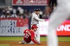 New York Yankees' Gleyber Torres throws out Cincinnati Reds' Kyle Farmer at first base after forcing out Tyler Stephenson (37) for a double play during the 10th inning of a baseball game Wednesday, July 13, 2022, in New York. The Yankees won 7-6. (AP Photo/Frank Franklin II)